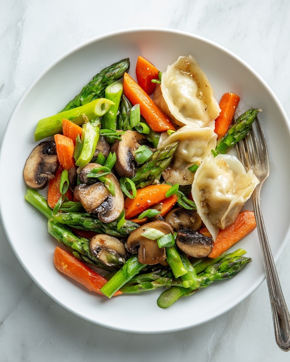The image shows a white plate filled with sautéed vegetables and dumplings. The bottom layer consists of bright green asparagus pieces cut into chunks, and medium slices of orange carrot, creating a colorful base. On top, there are browned sliced mushrooms with a glossy texture and vibrant green chopped scallions scattered throughout. Two dumplings sit near the center, one whole with a golden-brown, slightly crispy skin, and the other broken open showing a light beige filling inside. A silver fork is placed on the right side of the plate, partially underneath some vegetables. The plate rests on a white marbled surface, giving a clean and fresh look. Photo taken with an iphone --ar 4:5 --v 7