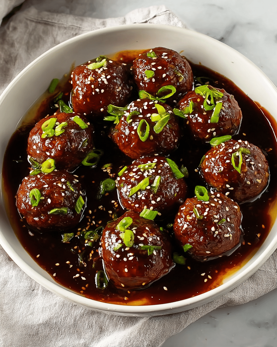 A white bowl filled with ten round meatballs covered in a thick, glossy dark brown sauce. The meatballs sit in the sauce with some of it pooling around them, giving a shiny and rich appearance. On top of each meatball, there are small white and light brown sesame seeds scattered evenly, along with chopped green onion pieces, adding a fresh green color contrast. The bowl is placed on a white cloth, all set against a white marbled surface. photo taken with an iphone --ar 4:5 --v 7
