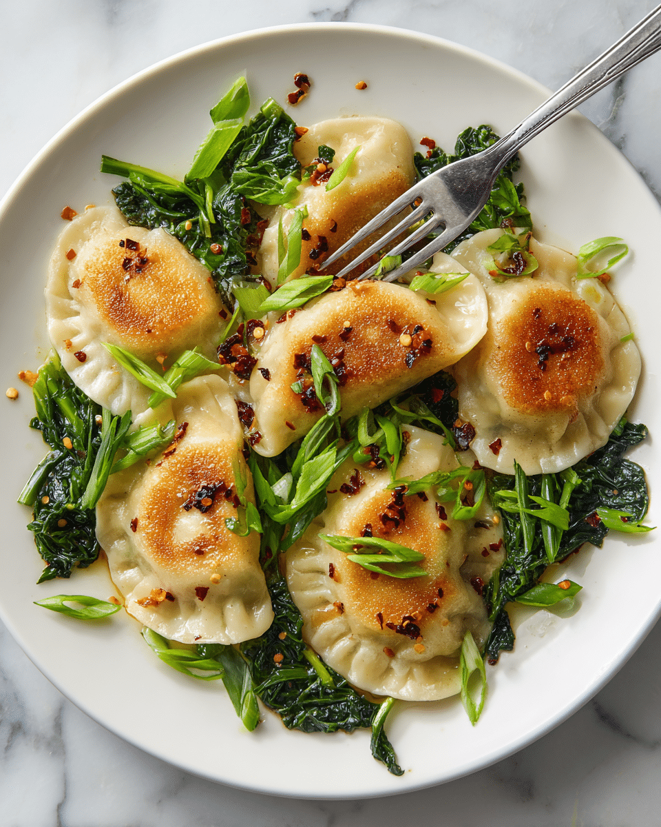 The image shows a close-up of a white bowl filled with golden-brown dumplings arranged side by side in a creamy orange sauce. Bright green spinach leaves are scattered between and under the dumplings, adding contrast. A shiny metal spoon holding one dumpling is resting on the edge inside the bowl, dipping slightly into the sauce. The dish sits on a white marbled surface with some sauce splashes visible on the bowl's rim. photo taken with an iphone --ar 4:5 --v 7